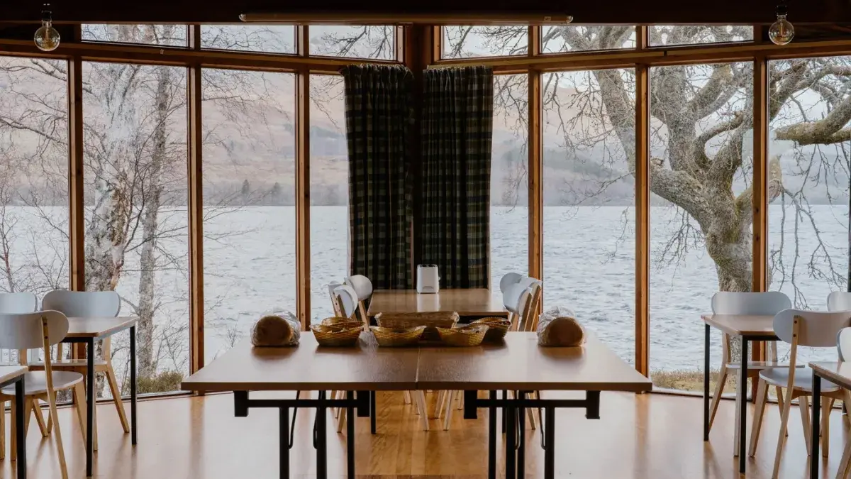image of breakfast table in open room, loch view