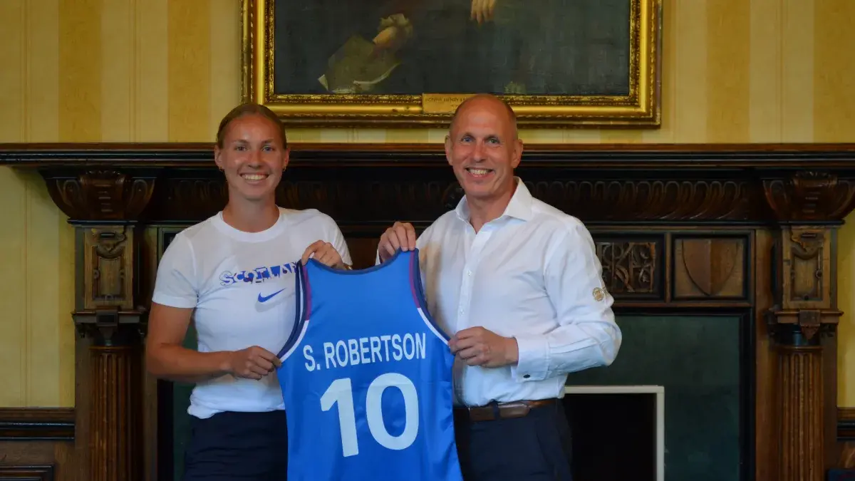Jim Aitken presenting Amy Costello with Strip