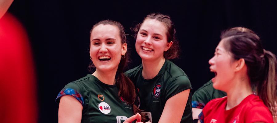 Volleyball teammates laughing together