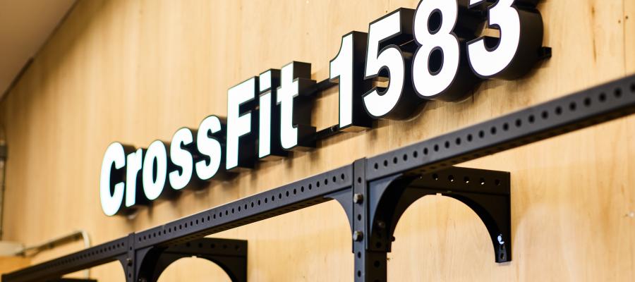 lightbox sign on wall reading CrossFit 1583