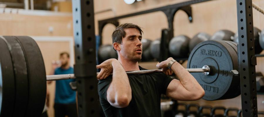 Image of man lifting weights in crossfit gym
