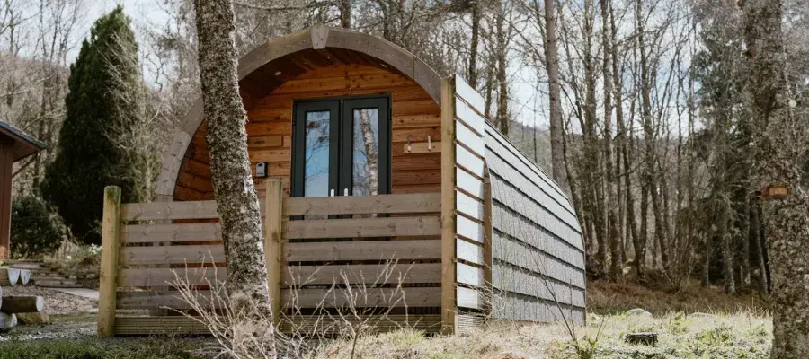 image of wooden lodge in woodland