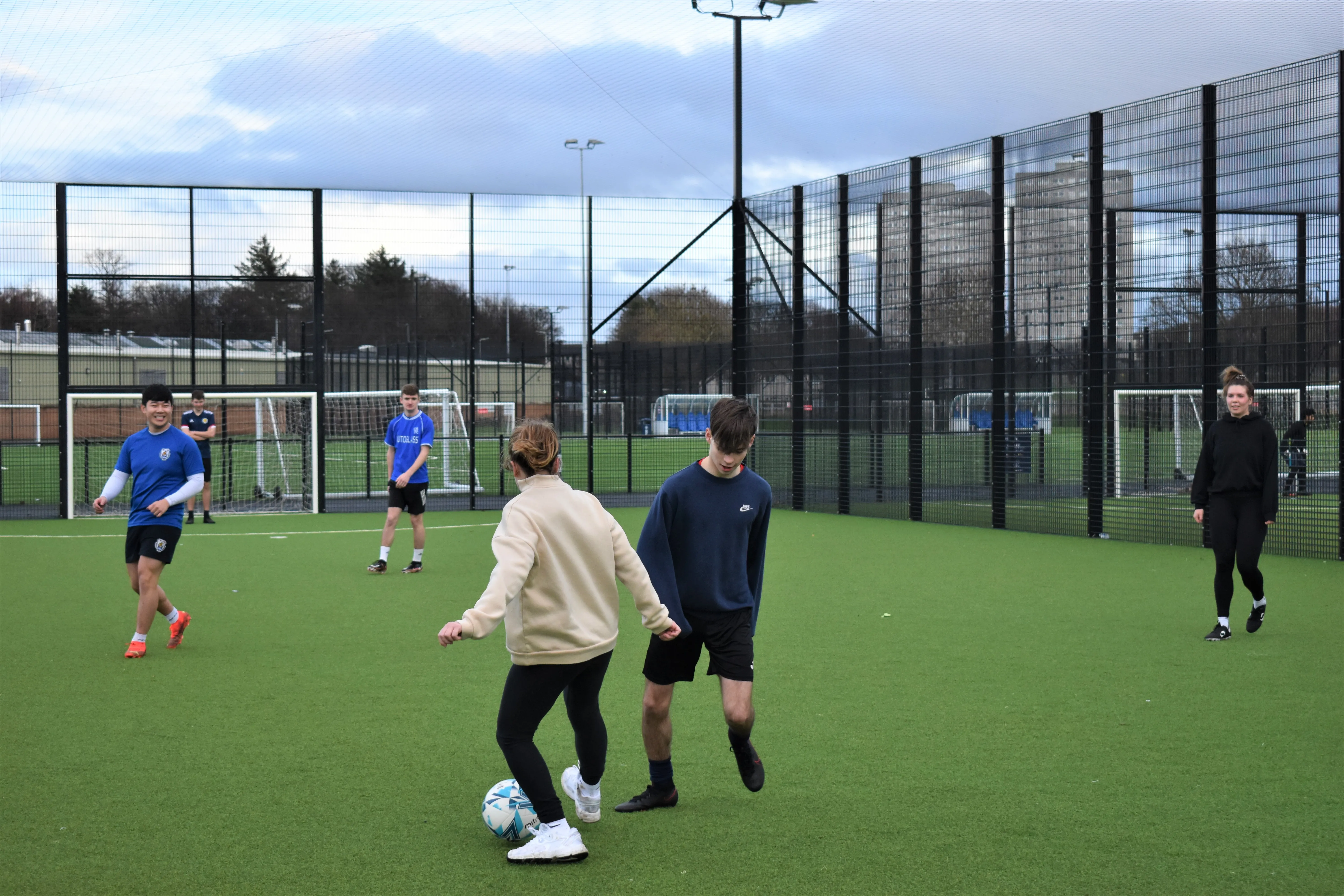 Students playing football at Peffermill