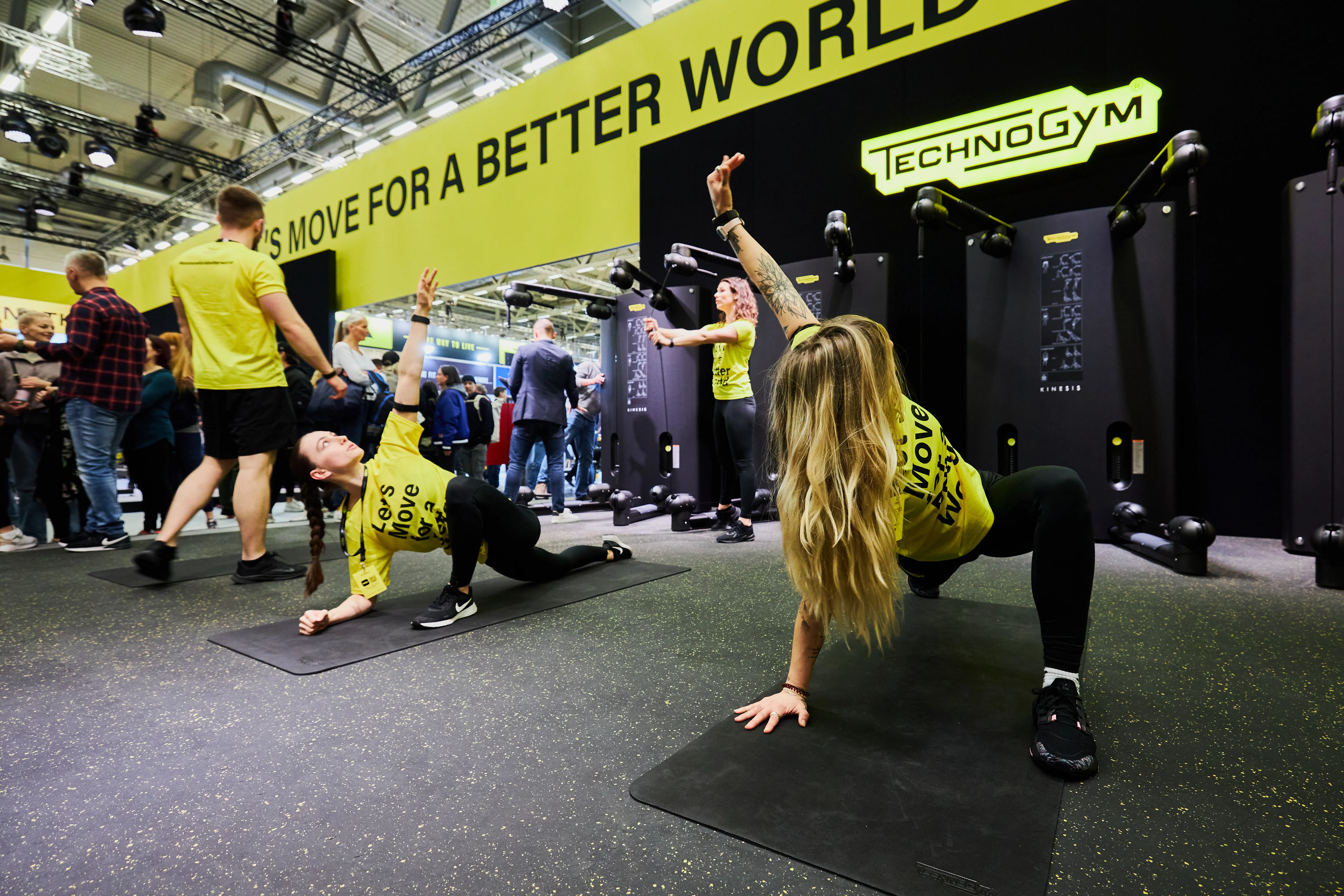 Image of Technogym staff demonstrating equipment
