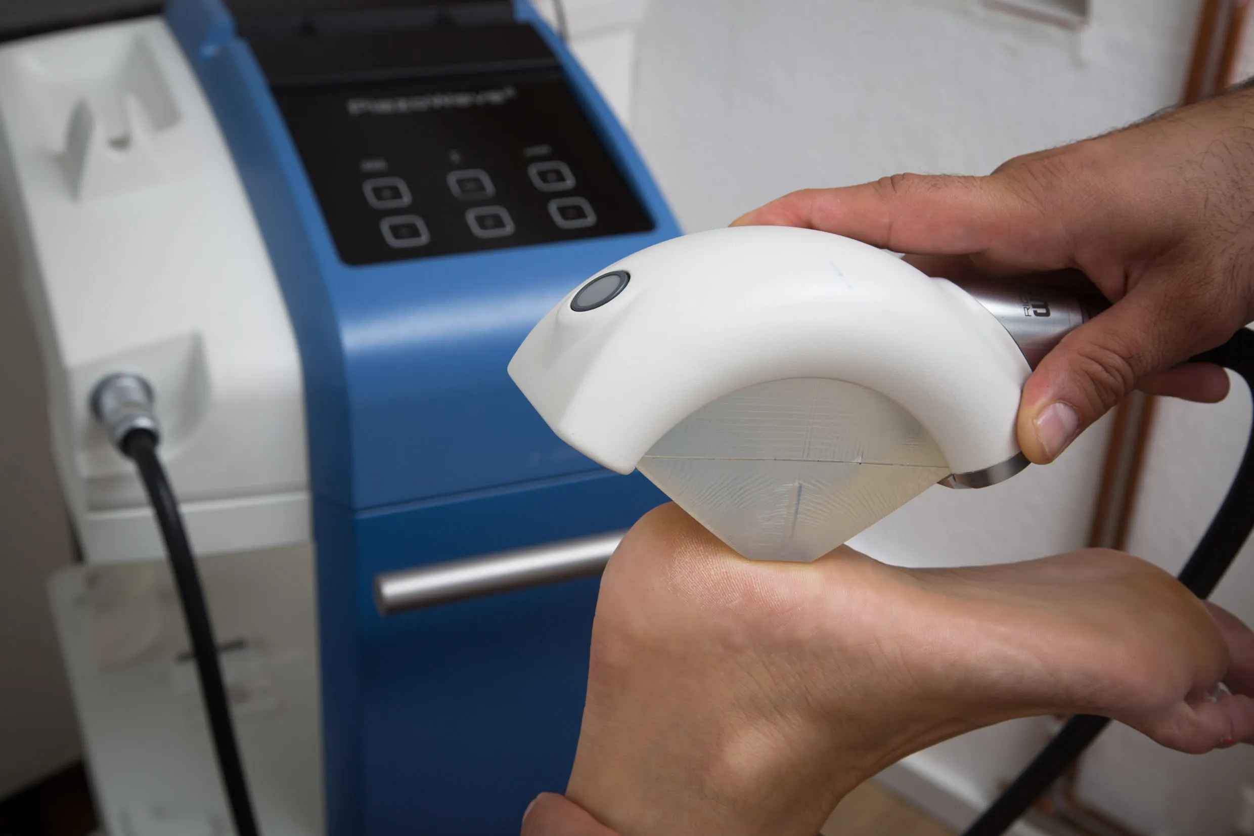 Image of piezowave2 shockwave treatment being used on heel of foot