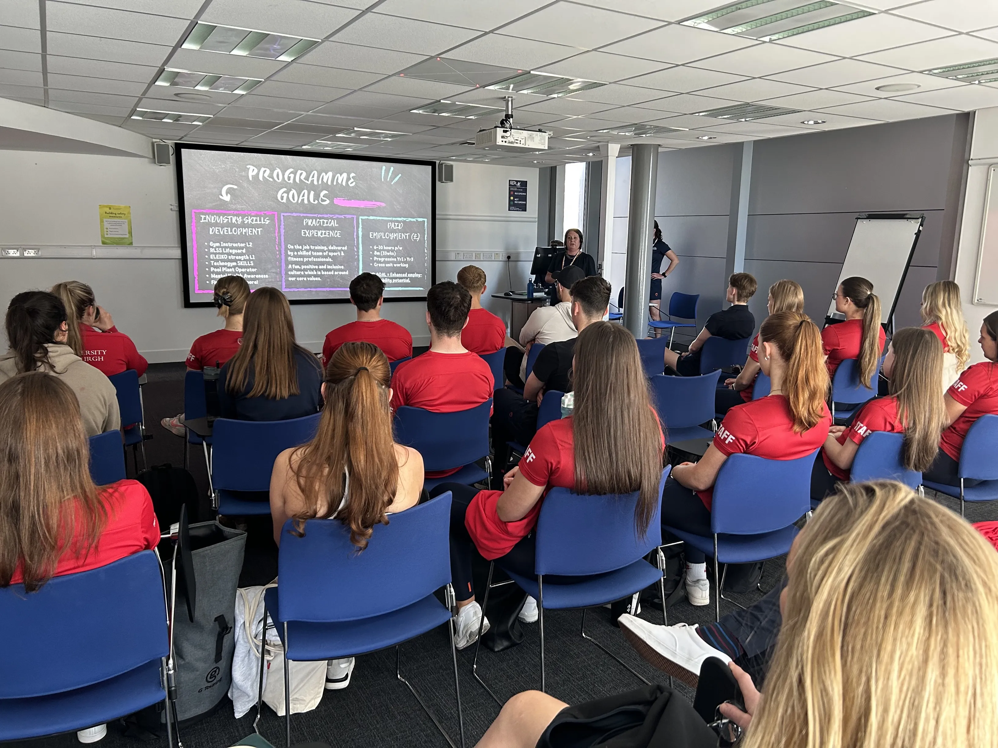 Group of students sitting in an induction session