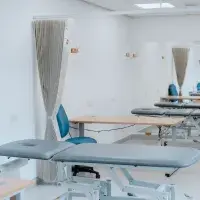 Image of Edinburgh Sports Clinic Space with massage bench and desk