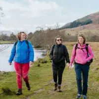 Three people 2walking outdoors in Scotland