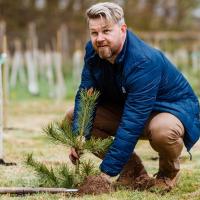 Sport & Exercise Assistant Director planting trees at Easter Bush 