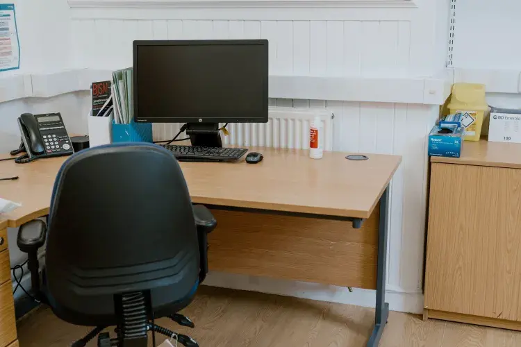 office space with computer screen