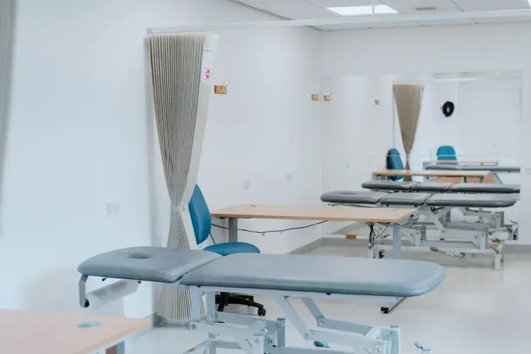 Image of Edinburgh Sports Clinic Space with massage bench and desk