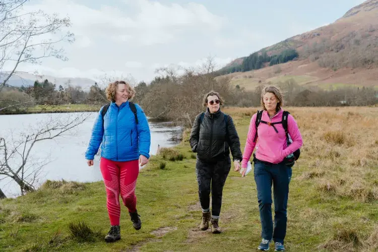 Three people 2walking outdoors in Scotland