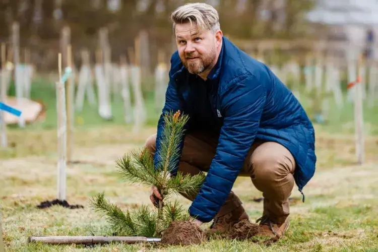 Sport & Exercise Assistant Director planting trees at Easter Bush 