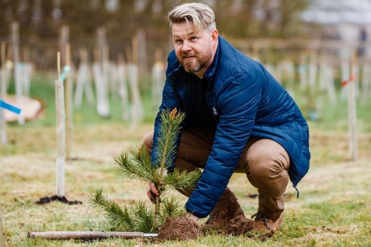 Sport & Exercise Assistant Director planting trees at Easter Bush 