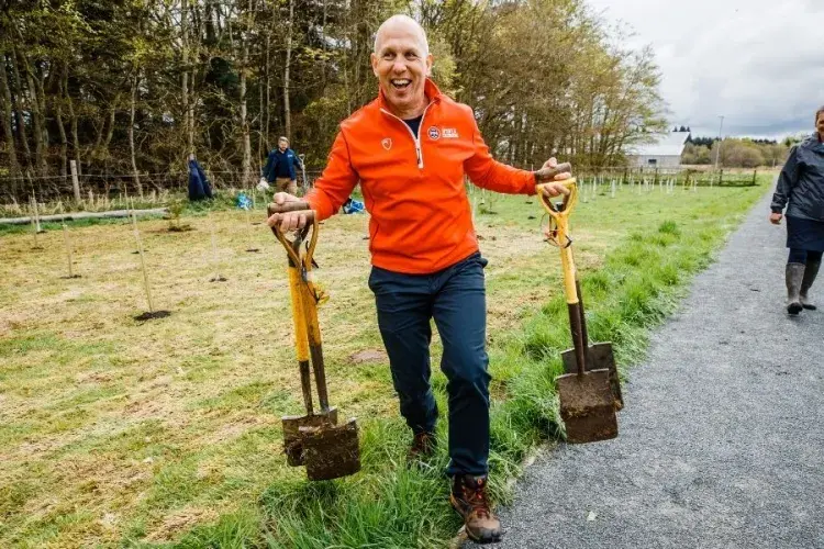 Director of Sport & Exercise carrying spades 